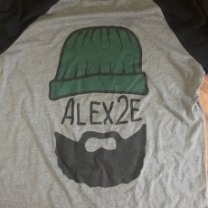 Stylized graphic of musician face on gray shirt